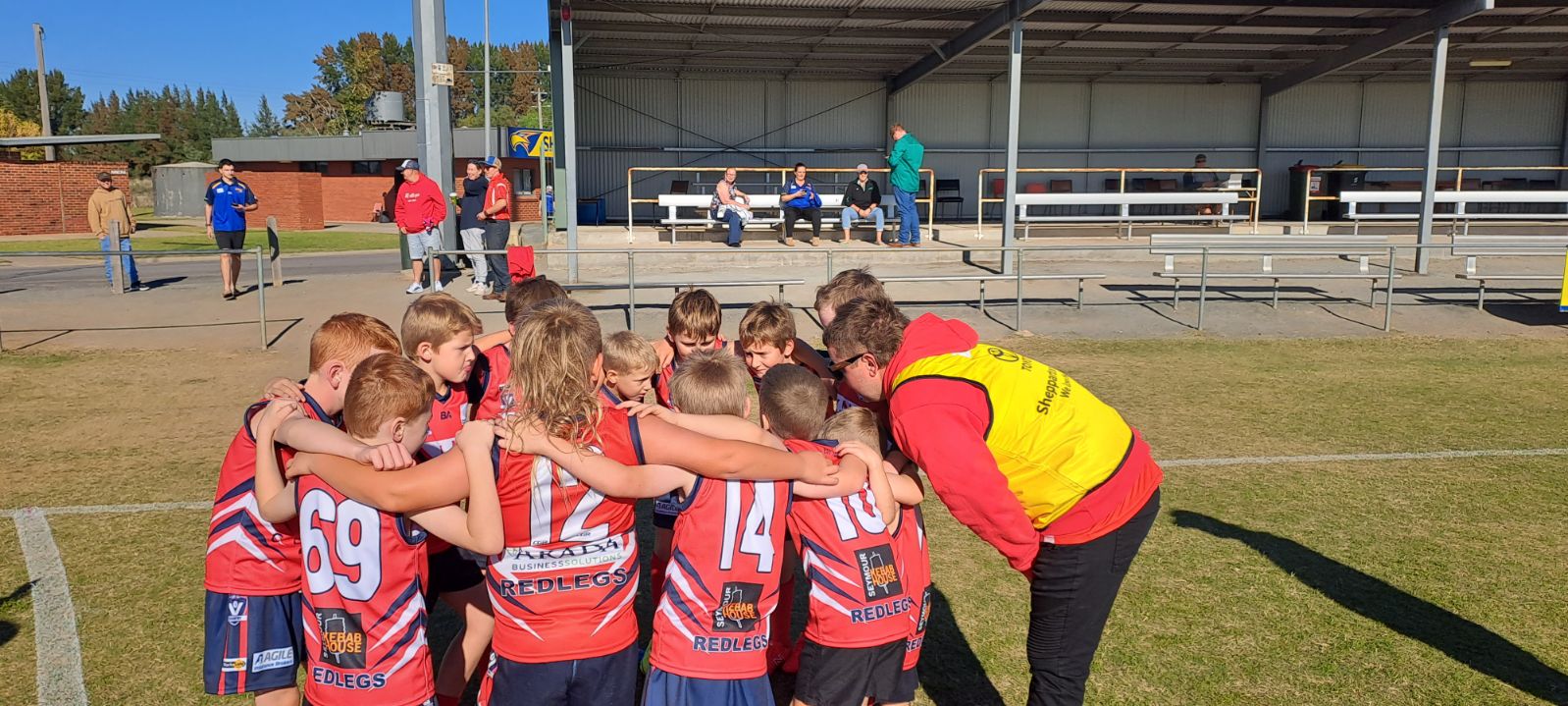 longwood junior team player having their team meeting before theri match